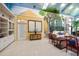 Inviting living room featuring unique mural and tiled flooring at 1835 Alicia Way, Clearwater, FL 33764