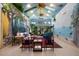 Unique living room features hand-painted walls, high ceilings, and comfortable seating at 1835 Alicia Way, Clearwater, FL 33764