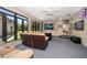 Recreation room with a wall of windows providing lots of light and comfortable seating at 1835 Alicia Way, Clearwater, FL 33764