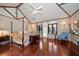 Spacious main bedroom featuring hardwood floors, vaulted ceilings and unique decor at 1835 Alicia Way, Clearwater, FL 33764