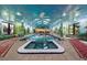Indoor pool and hot tub featuring a mural, skylights, and comfortable seating, perfect for relaxation at 1835 Alicia Way, Clearwater, FL 33764
