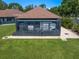 Exterior utility structure surrounded by manicured lawn and landscaping at 1835 Alicia Way, Clearwater, FL 33764