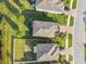 A bird's-eye view shows the tidy lawns and diverse rooflines of homes in a well-kept suburban area at 19656 Long Lake Ranch Blvd, Lutz, FL 33558