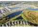 Stunning aerial view of a residential community featuring numerous homes and tranquil lakes at 19656 Long Lake Ranch Blvd, Lutz, FL 33558