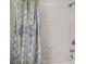 Bright bathroom with a shower featuring decorative patterned curtain at 19656 Long Lake Ranch Blvd, Lutz, FL 33558