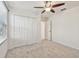 Neutral bedroom with ceiling fan and a closet with bi-fold doors at 19656 Long Lake Ranch Blvd, Lutz, FL 33558