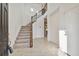 Bright foyer with tile floors, decorative wall and carpeted stairs with iron railing at 19656 Long Lake Ranch Blvd, Lutz, FL 33558
