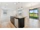 Open kitchen and living area with a spacious island, ideal for gatherings and everyday living at 19656 Long Lake Ranch Blvd, Lutz, FL 33558