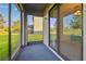 Screened in lanai overlooking a well-maintained yard and tranquil water view at 19656 Long Lake Ranch Blvd, Lutz, FL 33558