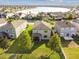 An aerial shot of the back of a well-maintained home with green lawn and simple landscaping in a suburban neighborhood at 19656 Long Lake Ranch Blvd, Lutz, FL 33558