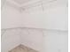 Walk-in closet with white walls and metal shelving at 19656 Long Lake Ranch Blvd, Lutz, FL 33558