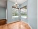 Bright dining area featuring large windows with a view of the screened pool at 2409 Heather Manor Ln, Lutz, FL 33549