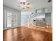 Open-concept kitchen and living area with tile backsplash and stainless steel appliances at 2409 Heather Manor Ln, Lutz, FL 33549