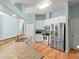 Open floor plan kitchen with granite countertops and stainless steel appliances at 2409 Heather Manor Ln, Lutz, FL 33549