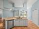 Eat-in kitchen area with a breakfast bar, white cabinets and stainless steel appliances at 2409 Heather Manor Ln, Lutz, FL 33549
