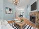 Comfortable living room with fireplace, chandelier, and artwork creates a relaxing atmosphere at 2409 Heather Manor Ln, Lutz, FL 33549