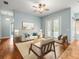 Inviting living room with French doors leading to a pool at 2409 Heather Manor Ln, Lutz, FL 33549