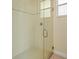 Modern shower with glass door and bright tiles at 2409 Heather Manor Ln, Lutz, FL 33549