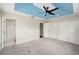 Comfortable bedroom with a tray ceiling, large closet, and an en-suite bathroom at 2570 Sea Wind Way, Clearwater, FL 33763