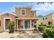 Charming two-story home with a well-manicured lawn, covered porch and attractive landscaping at 2570 Sea Wind Way, Clearwater, FL 33763