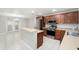 Kitchen features stainless appliances, ample cabinet space and an eat-in breakfast bar at 2570 Sea Wind Way, Clearwater, FL 33763