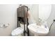 Contemporary powder room featuring modern fixtures, storage, and stylish decor at 2570 Sea Wind Way, Clearwater, FL 33763
