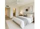 Serene bedroom with a plush bed, neutral tones, and contemporary artwork at 2621 Cove Cay Dr # 206, Clearwater, FL 33760