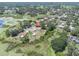 A charming home boasts a private pool and is surrounded by lush greenery and serene lake views at 271 Eastpoint Ct, Spring Hill, FL 34606