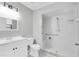 Bright bathroom with a spacious, accessible shower, sleek vanity, and black and white flooring at 271 Eastpoint Ct, Spring Hill, FL 34606