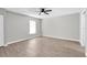 Open bedroom featuring modern flooring, natural light from a window and a ceiling fan at 271 Eastpoint Ct, Spring Hill, FL 34606