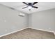 An empty bedroom with laminate floors and ceiling fan at 271 Eastpoint Ct, Spring Hill, FL 34606