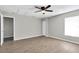Large bedroom with wood-look flooring, a ceiling fan and natural light from a window at 271 Eastpoint Ct, Spring Hill, FL 34606