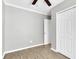 This bedroom features a ceiling fan, laminate floors, and closet at 271 Eastpoint Ct, Spring Hill, FL 34606