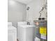 This laundry room is equipped with a washing machine, dryer, and water heater at 271 Eastpoint Ct, Spring Hill, FL 34606
