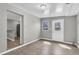 Living room featuring gray walls, wood flooring, and natural light from an exterior door at 271 Eastpoint Ct, Spring Hill, FL 34606