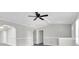 Spacious living room boasts neutral paint, tile floors, and ceiling fan at 271 Eastpoint Ct, Spring Hill, FL 34606