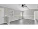Bright living room boasts neutral paint, tile floors and a modern ceiling fan at 271 Eastpoint Ct, Spring Hill, FL 34606