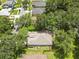An aerial view of the house showcasing the roof, trees, and a fenced backyard at 2910 Red Coat Cir, Brandon, FL 33511