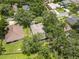 Aerial view of the house showcasing the roof, trees, and surrounding neighborhood at 2910 Red Coat Cir, Brandon, FL 33511