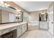 Spacious bathroom with double sink vanity, soaking tub, and tiled floors at 2910 Red Coat Cir, Brandon, FL 33511