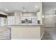 Kitchen featuring breakfast bar with white cabinetry and lots of natural light at 2910 Red Coat Cir, Brandon, FL 33511