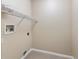 Functional laundry room with tile flooring, utility connections, and a wire shelf at 2910 Red Coat Cir, Brandon, FL 33511