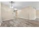 Large living room with light wood-look floors, neutral walls, and recessed lighting at 2910 Red Coat Cir, Brandon, FL 33511