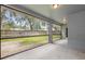 Spacious screened-in patio, perfect for enjoying outdoor living and the lush greenery of the backyard at 2910 Red Coat Cir, Brandon, FL 33511