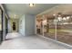 Inviting screened porch with access to the kitchen through sliding glass doors and a side entrance at 2910 Red Coat Cir, Brandon, FL 33511
