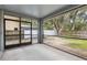 Relaxing screened porch offers views of the backyard and a peaceful outdoor living space at 2910 Red Coat Cir, Brandon, FL 33511