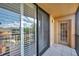The screened balcony, accessible through sliding doors, offers natural light and serene outdoor views at 3062 Eastland Blvd # 311, Clearwater, FL 33761