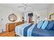 Bright bedroom features a double bed, hardwood floors, and a ceiling fan at 3062 Eastland Blvd # 311, Clearwater, FL 33761