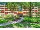 Attractive condo complex with well-maintained landscaping and trees leading to the entrance at 3062 Eastland Blvd # 311, Clearwater, FL 33761