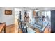 Open dining room area featuring hardwood flooring, and views of the kitchen at 3062 Eastland Blvd # 311, Clearwater, FL 33761